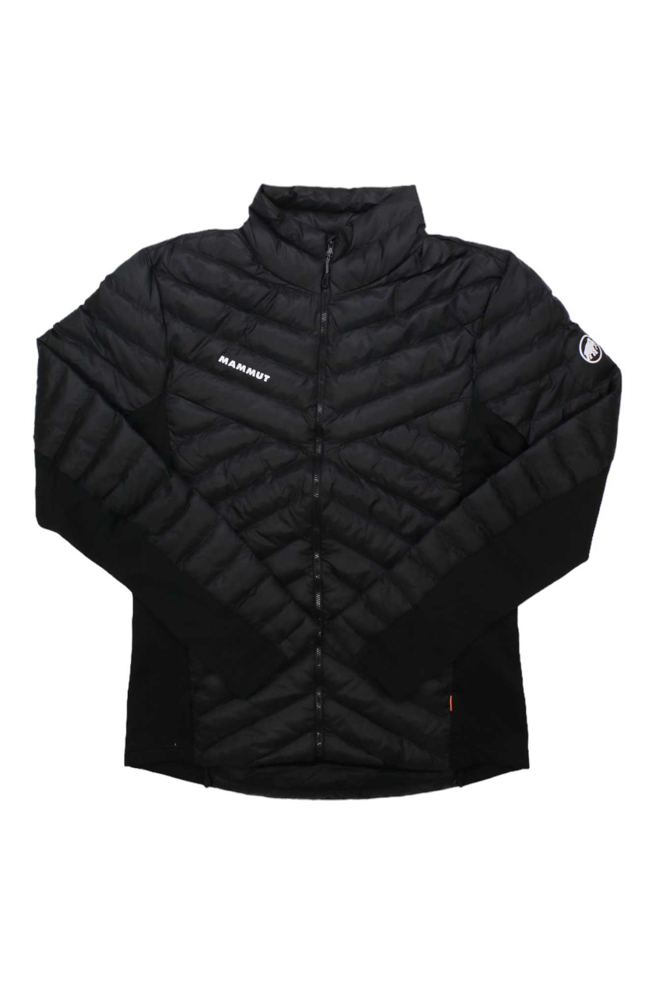 The Mammut Mens Albula IN Hybrid Jacket is a black quilted hiking jacket with a front zipper, standing collar, and Mammut logos on the left chest and upper left sleeve. Sleeves and sides feature smooth black fabric with synthetic insulation.