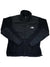 The Denali Fleece Jacket by The North Face is black with a zip-up front, high collar, and logo on the left chest. Made from recycled fleece with smooth and textured panels, it offers zippered side/chest pockets for cold-weather comfort.