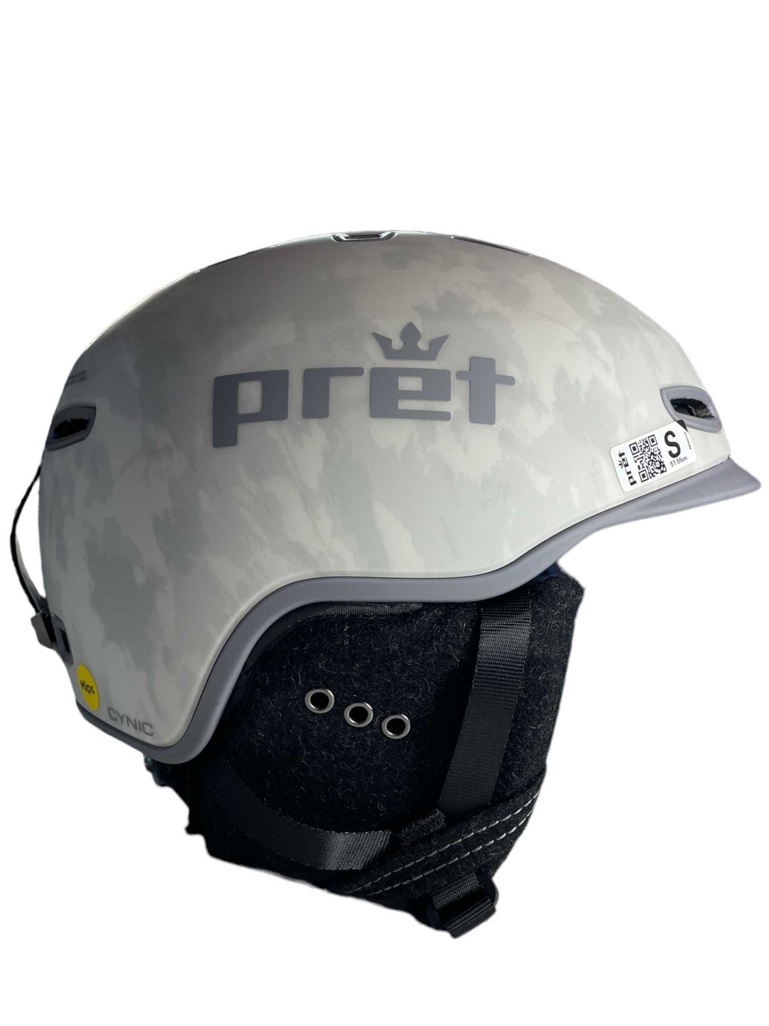 A Pret Men's Cynic X2 Ski Helmet in gray with a subtle camouflage pattern, black adjustable straps, adjustable venting, size S label, and a QR code sticker on the side.