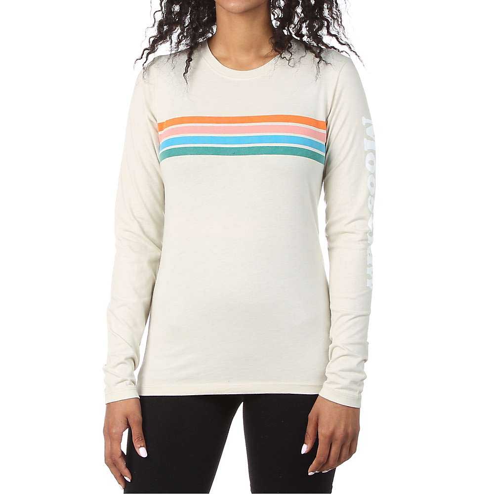 A person wears the Moosejaw Womens Original Stripe LS Tee—an organic cotton long sleeve with orange, blue, and teal chest stripes and left sleeve text—paired with black pants for a casual look.