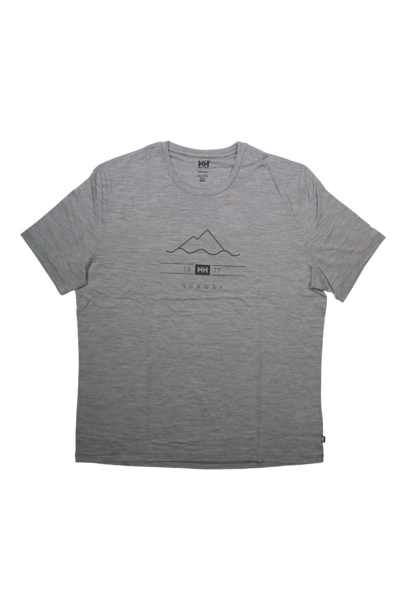 The Helly Hansen Mens HH Merino Graphic T-Shirt is a light gray, quick-dry short-sleeve tee with a simple mountain line drawing and "HH 1877 NORWAY" text printed in black on the front, ideal for comfort on any adventure.