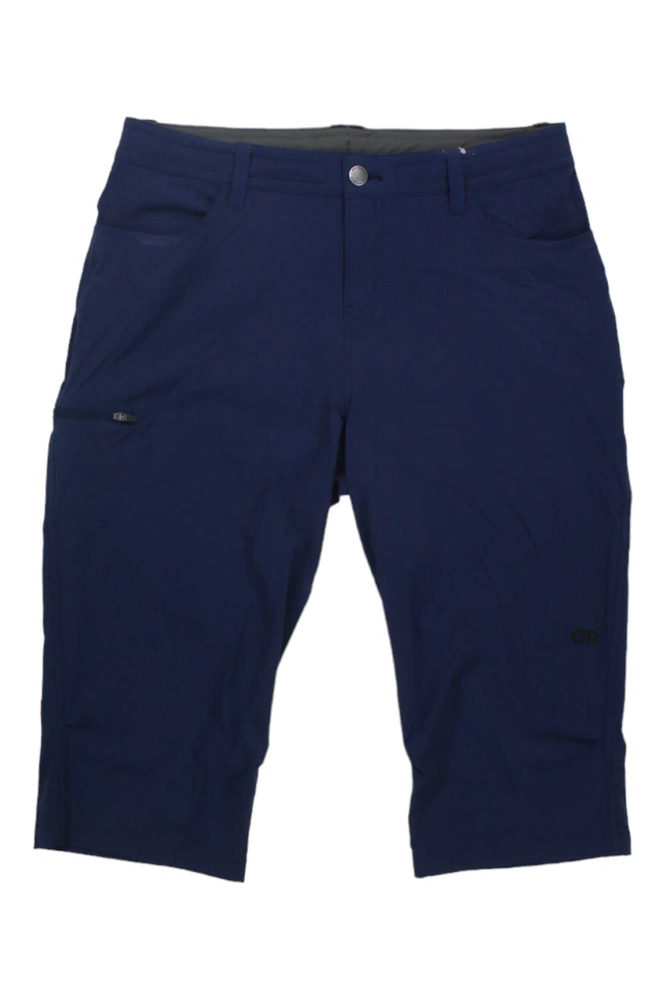 The Outdoor Research Women's Ferrosi Capri are navy blue, abrasion-resistant knee-length shorts featuring front and side pockets, a button-zipper closure, and a subtle logo on the lower left leg.