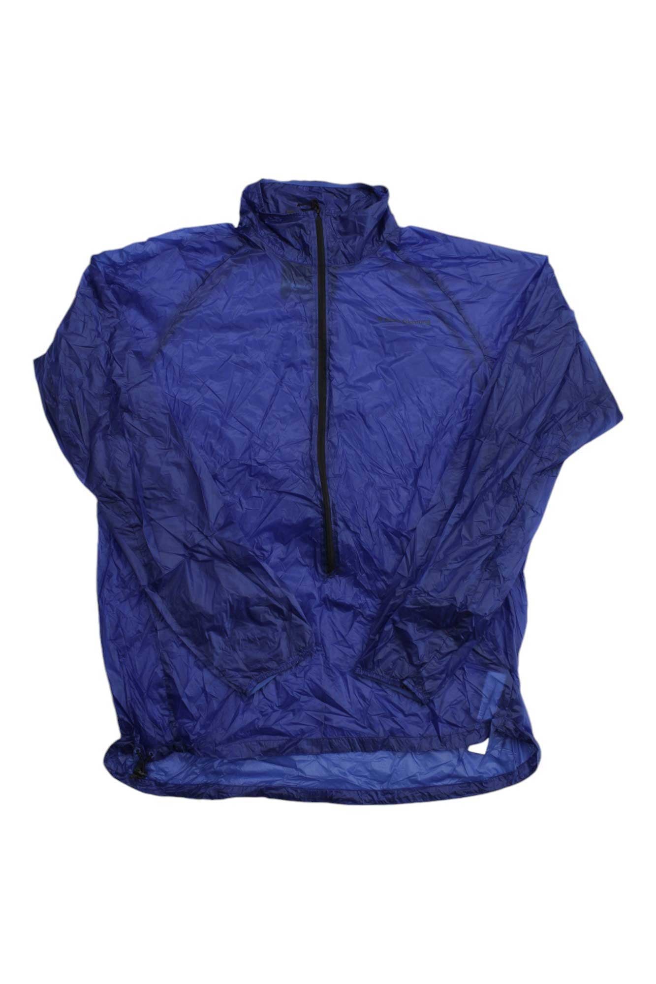 The Black Diamond Men's Deploy Wind Shell Jacket is a lightweight, crinkled blue windbreaker with long sleeves, high collar, and black half-zip front—an ideal packable jacket for any adventure. Shown laid flat on a white background.