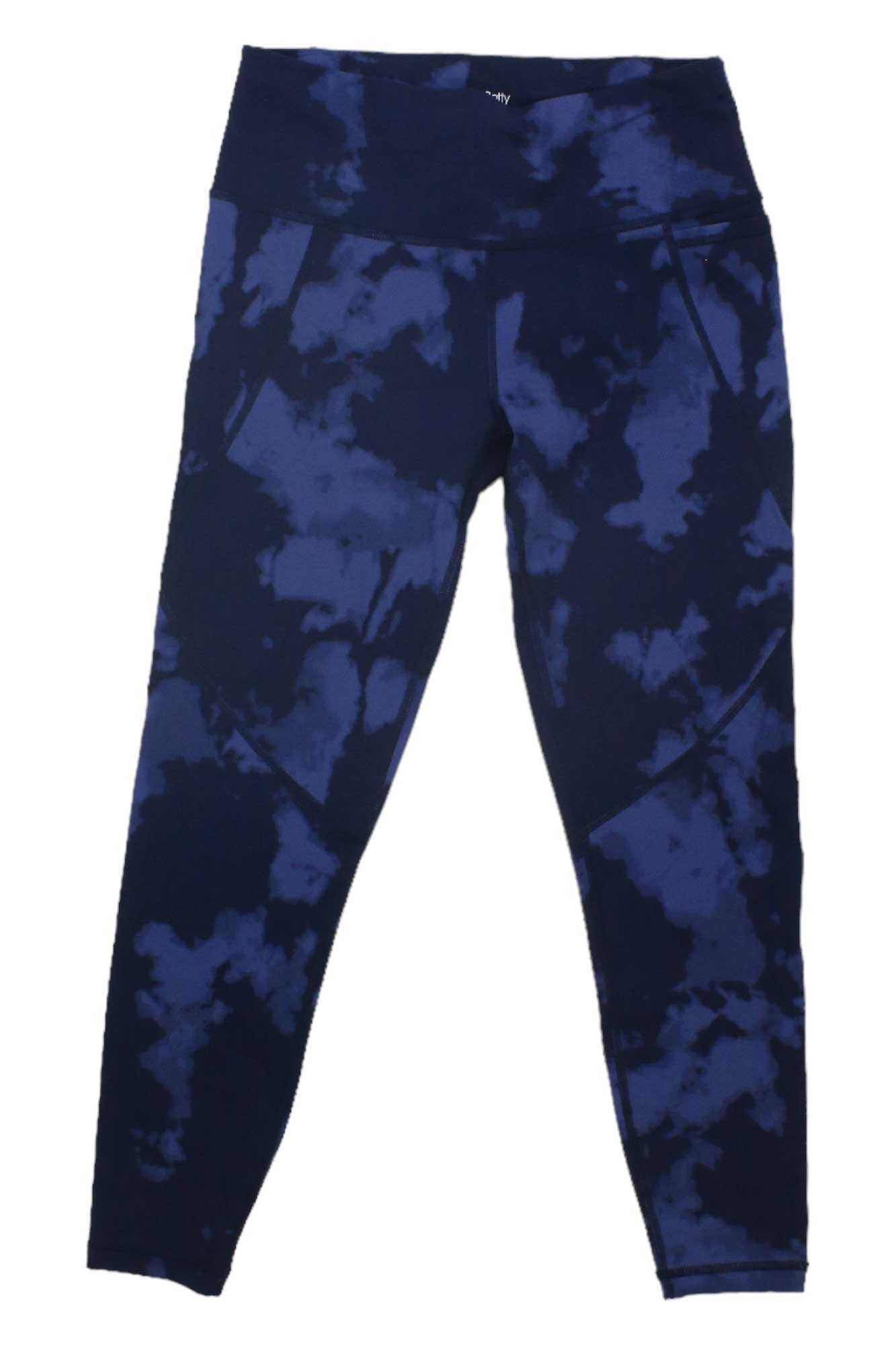 The Sweaty Betty Womens Power 7/8 Workout Legging features a high-waisted, ankle-length fit in blue and black tie-dye, with sweat-wicking fabric, side pockets, and flat seams for a smooth look.