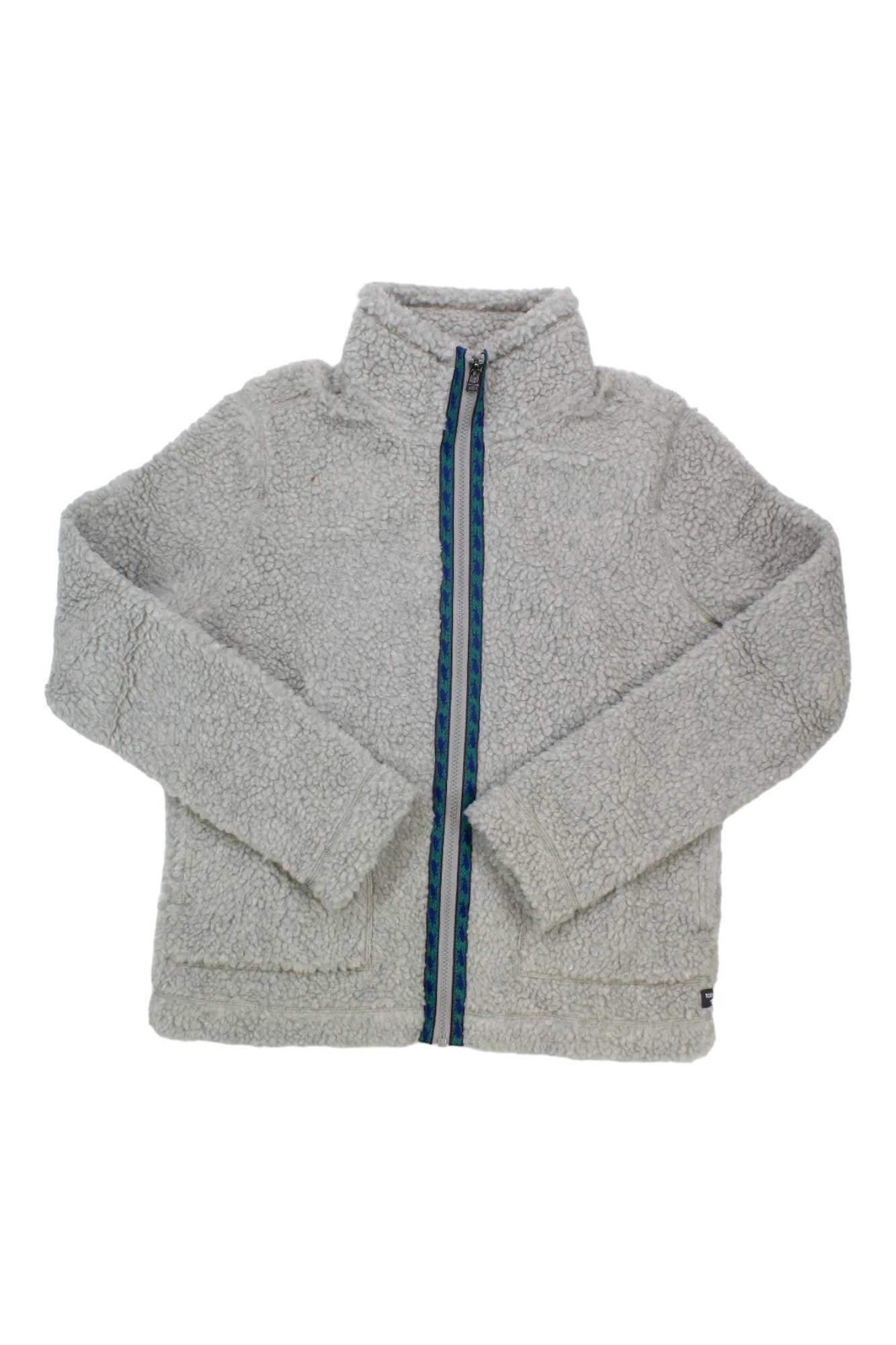 The Toad & Co Womens Sespe Sherpa Zip Jacket is a light gray zip-up with a high collar and blue-trimmed zipper, shown laid flat on a white background.
