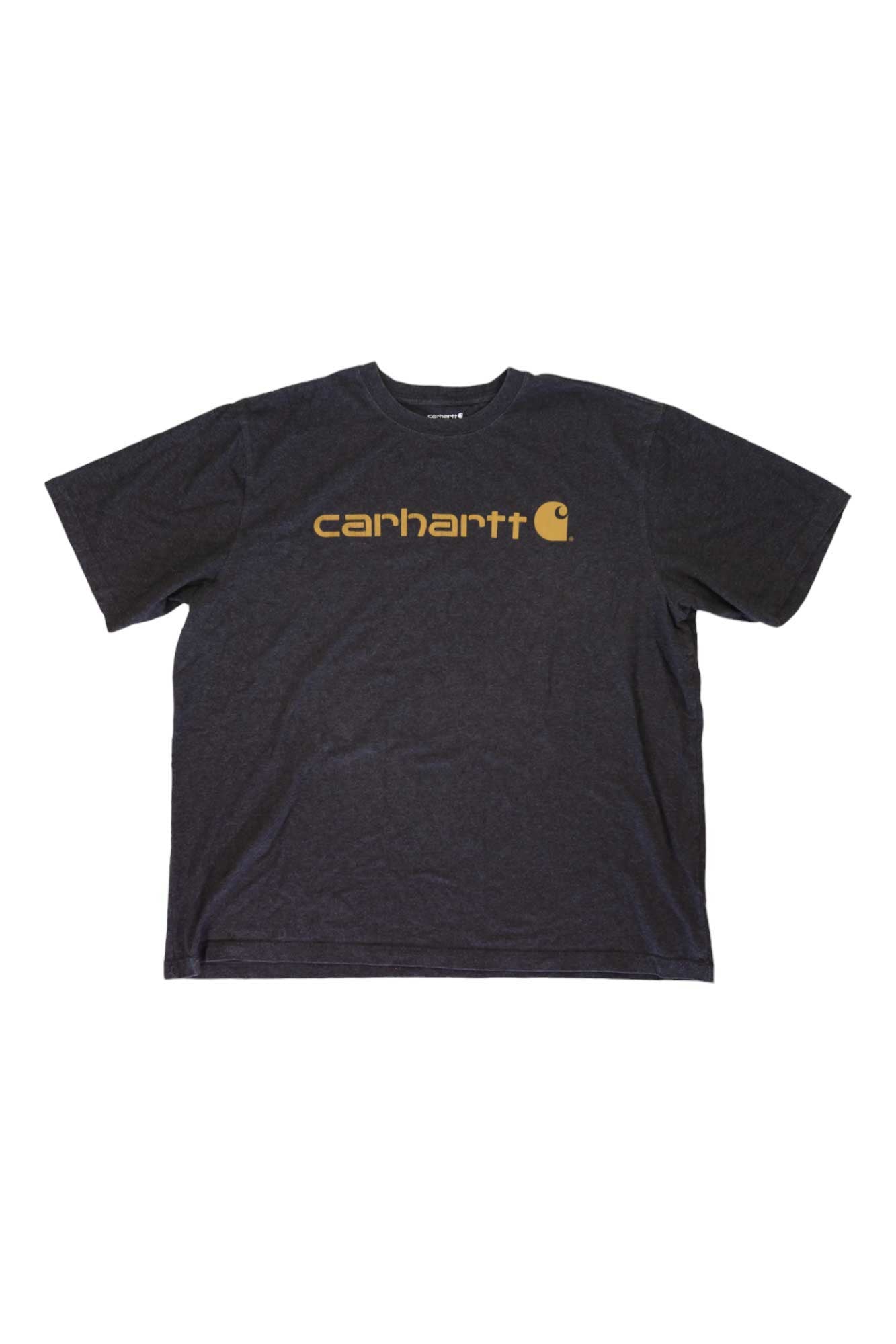 A Carhartt Men's Loose Fit Heavyweight Short Sleeve Logo Graphic T-Shirt in black, featuring the iconic yellow logo on the chest, is laid flat on a white background.