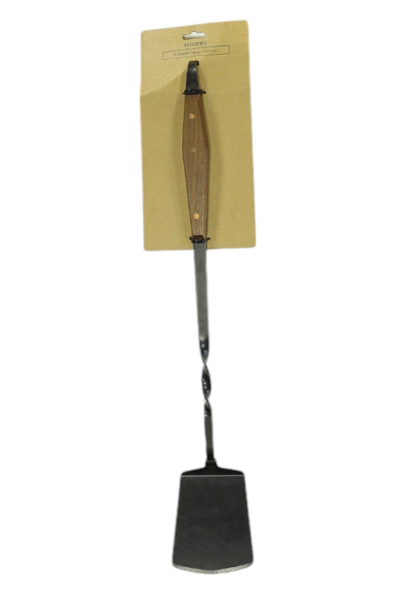 Cowboy grill spatula with dark handle and wide metal cooking blade, in retail packaging