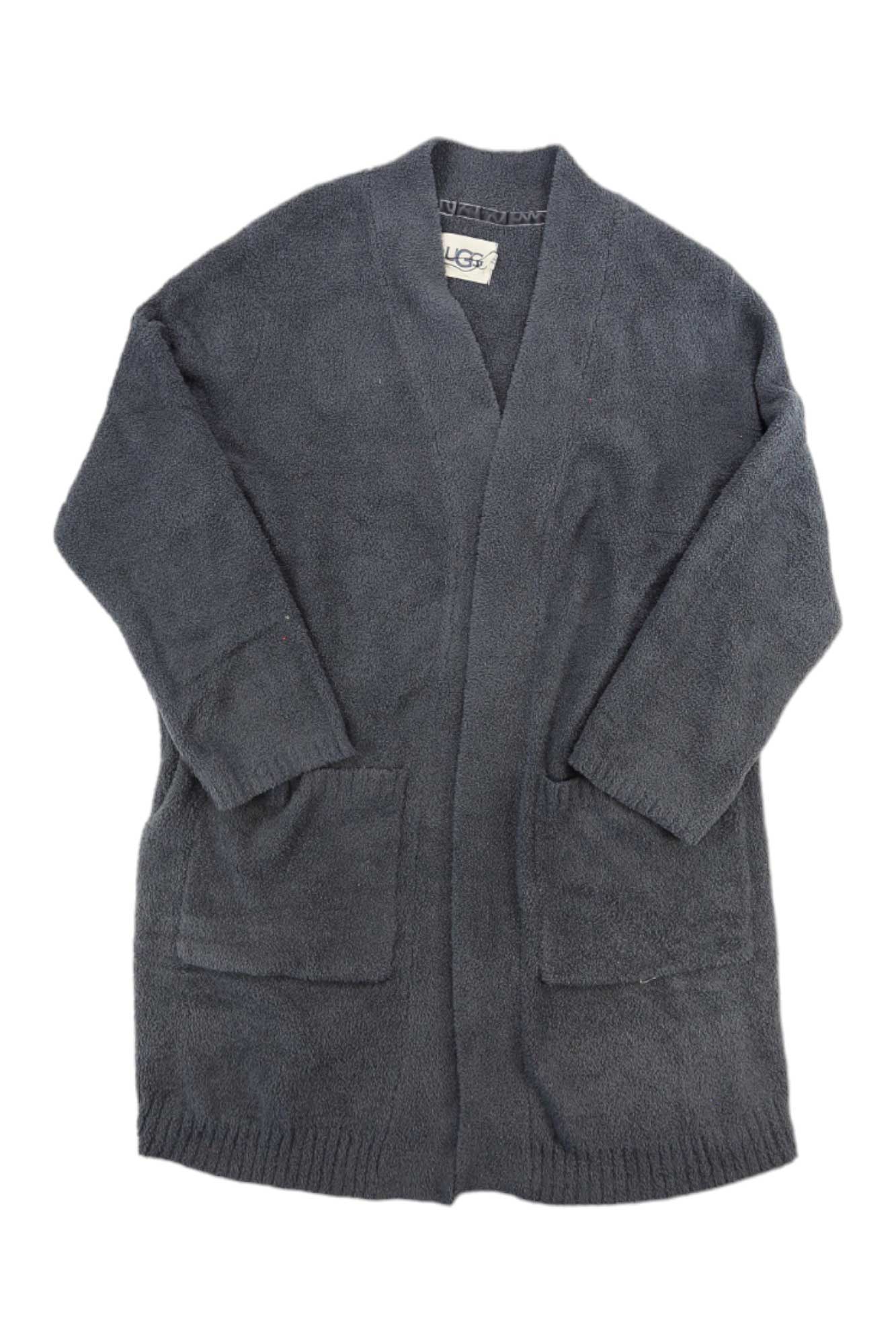 The UGG Womens Kallie Cardigan is a long, dark gray knit open cardigan with two large front pockets, long sleeves, and a ribbed hem, crafted from recycled polyester sweater material and displayed flat on a white background.