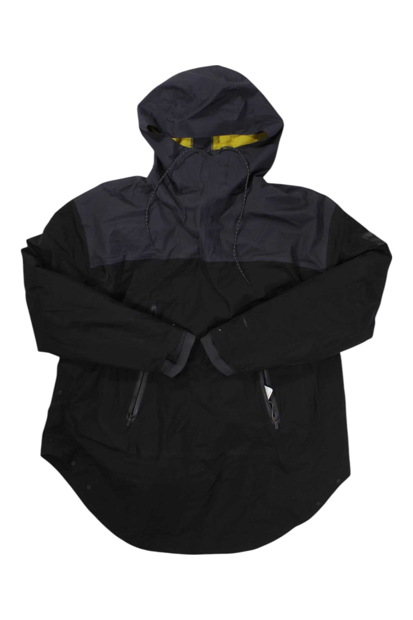 A black and dark gray insulated jacket with premium down, zippered side pockets, and a yellow-lined hood, laid flat on white—The North Face Women’s Cryos 3L New Winter Cagoule.