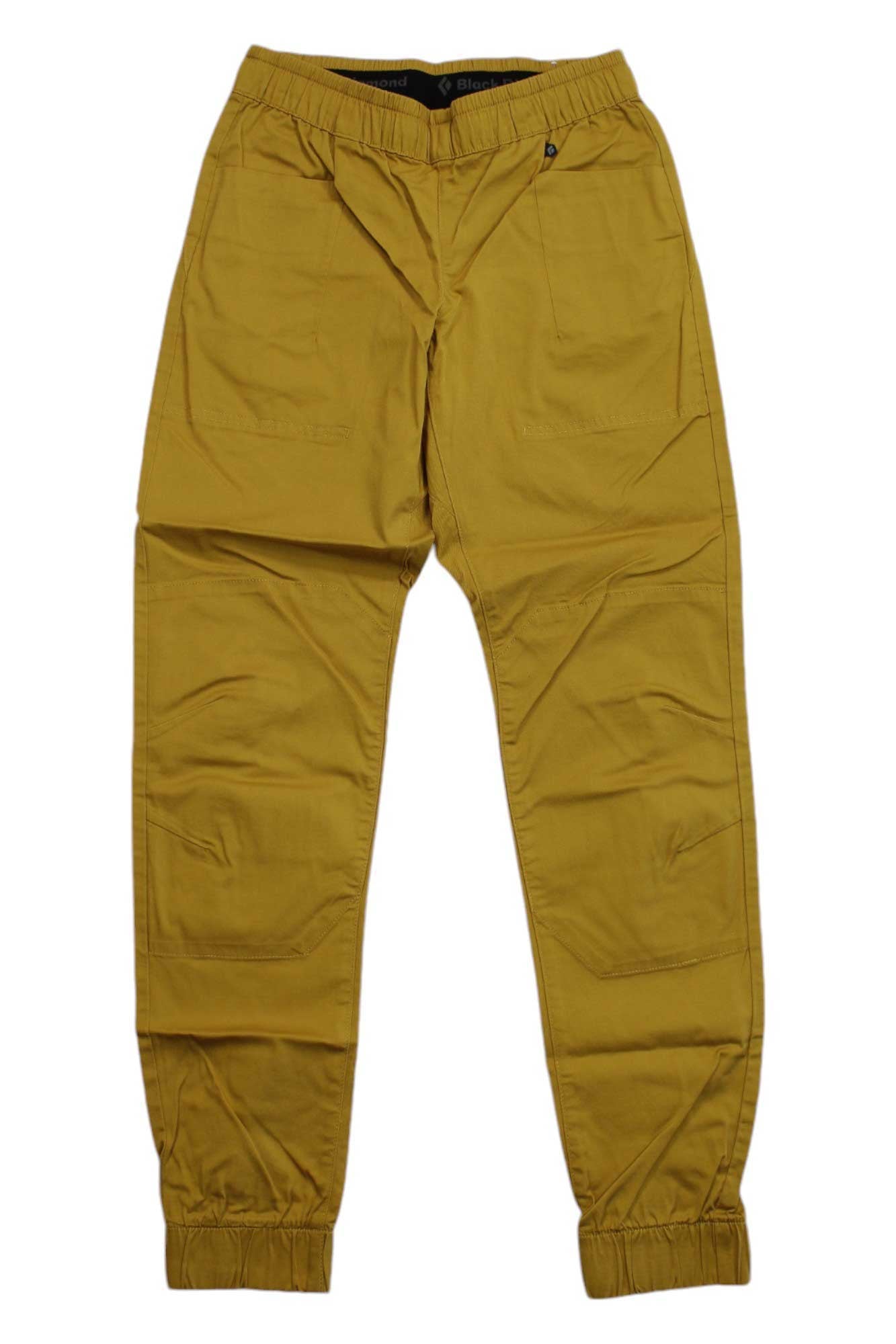 A pair of Black Diamond Womens Notion SP Pants in mustard yellow, made from organic cotton with an elastic waistband, side pockets, and elastic ankle cuffs, displayed flat on a white background.