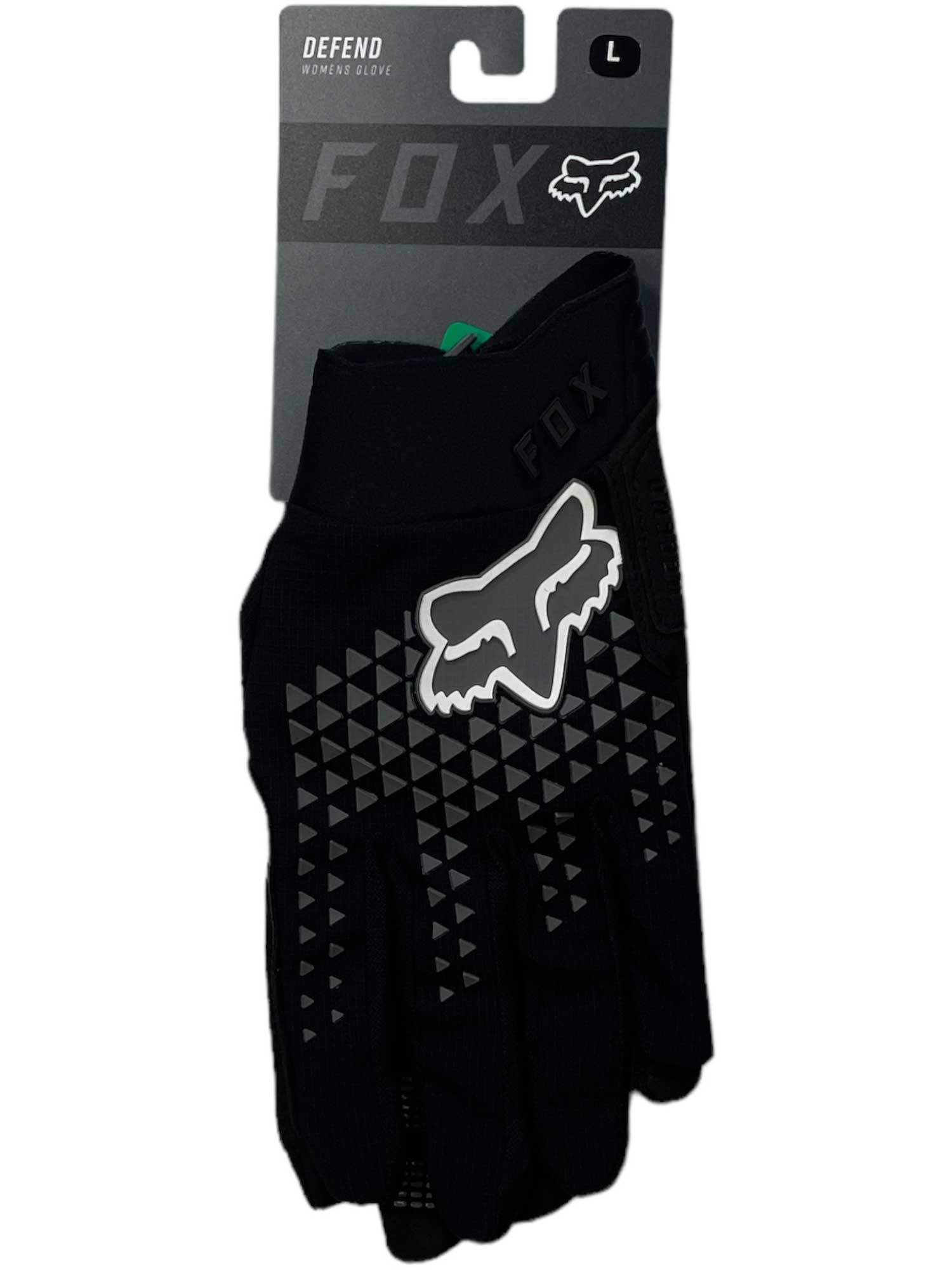 The Fox Women's Defend Glove is a black, size large mountain biking glove featuring a white Fox head logo and gray triangles on the back. It's touchscreen compatible and comes displayed in its original packaging.