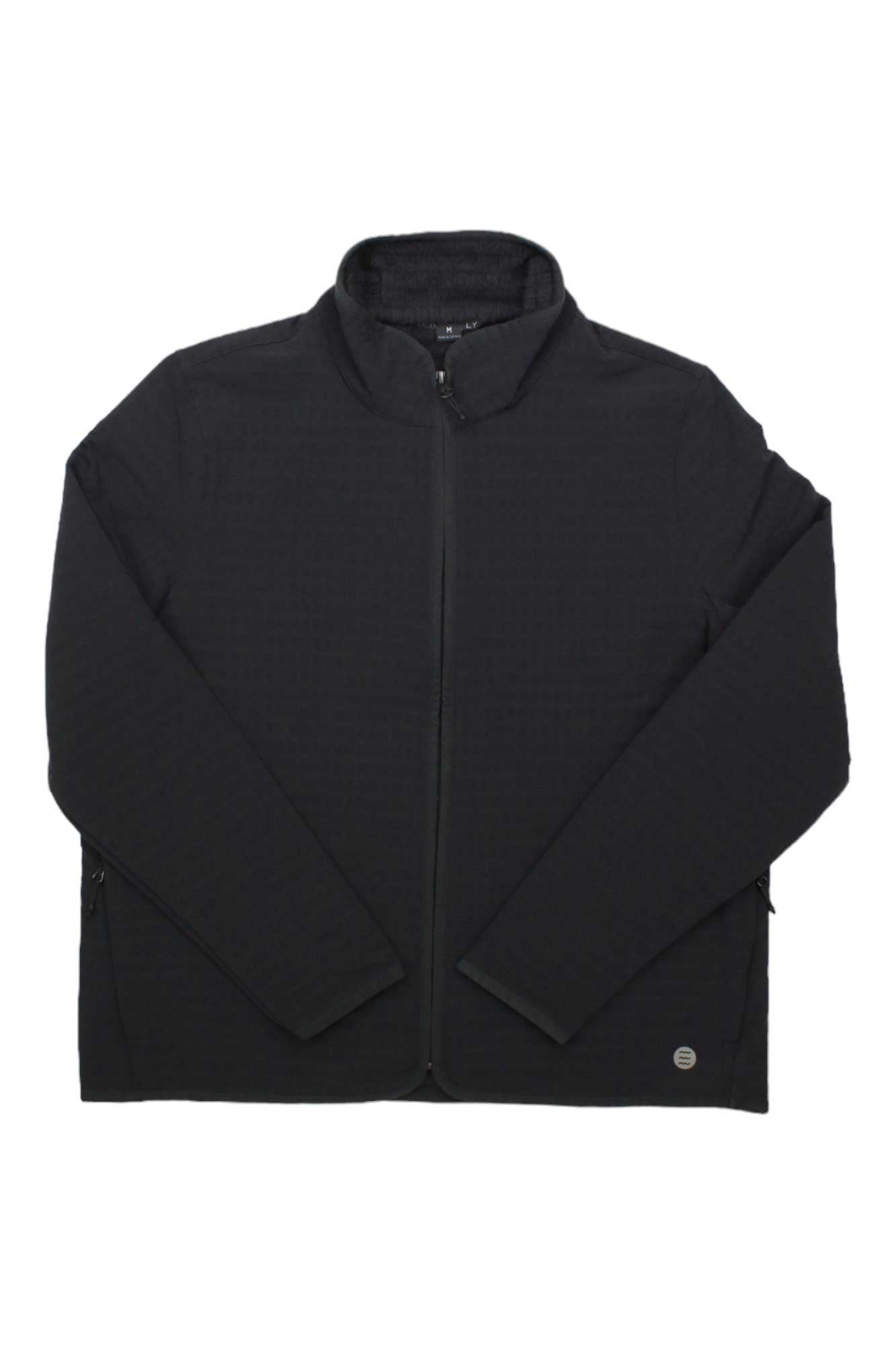 The Free Fly Womens Gridback Fleece Jacket is a black full-zip bomber with a textured gridback pattern and a Free Fly logo on the lower right hem.