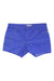 The Carve Designs Women's Oahu 4 Inch Short in bright blue features front and back pockets, belt loops, visible stitching, a slim fit, frayed hem, and metal rivets. Shorts are laid flat on a white background.