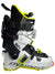 The Dynafit Hoji Free 110 Ski Boot offers multiple buckles and straps for alpine touring, a progressive forward flex for top performance, and features the DYNAFIT logo on the side. Available in white, black, and neon yellow.