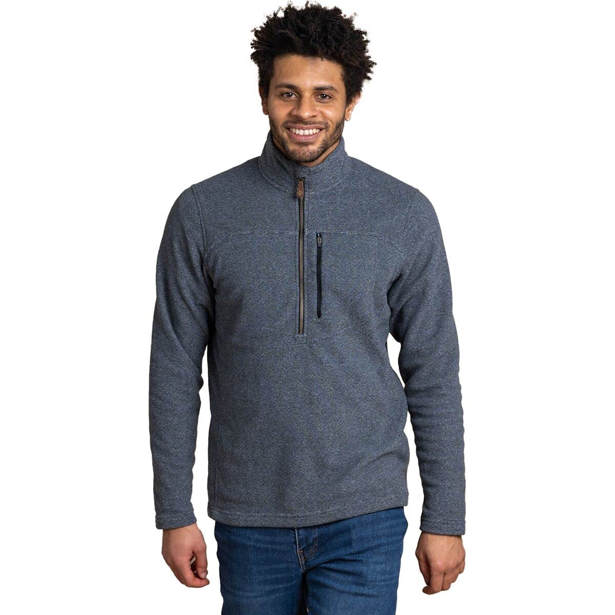 A man with curly hair and a beard is smiling, wearing the Men's Rolpa Quarter Zip Fleece with a zippered chest pocket. Made from lightweight polyester fleece, he stands against a white background, hands relaxed at his sides.