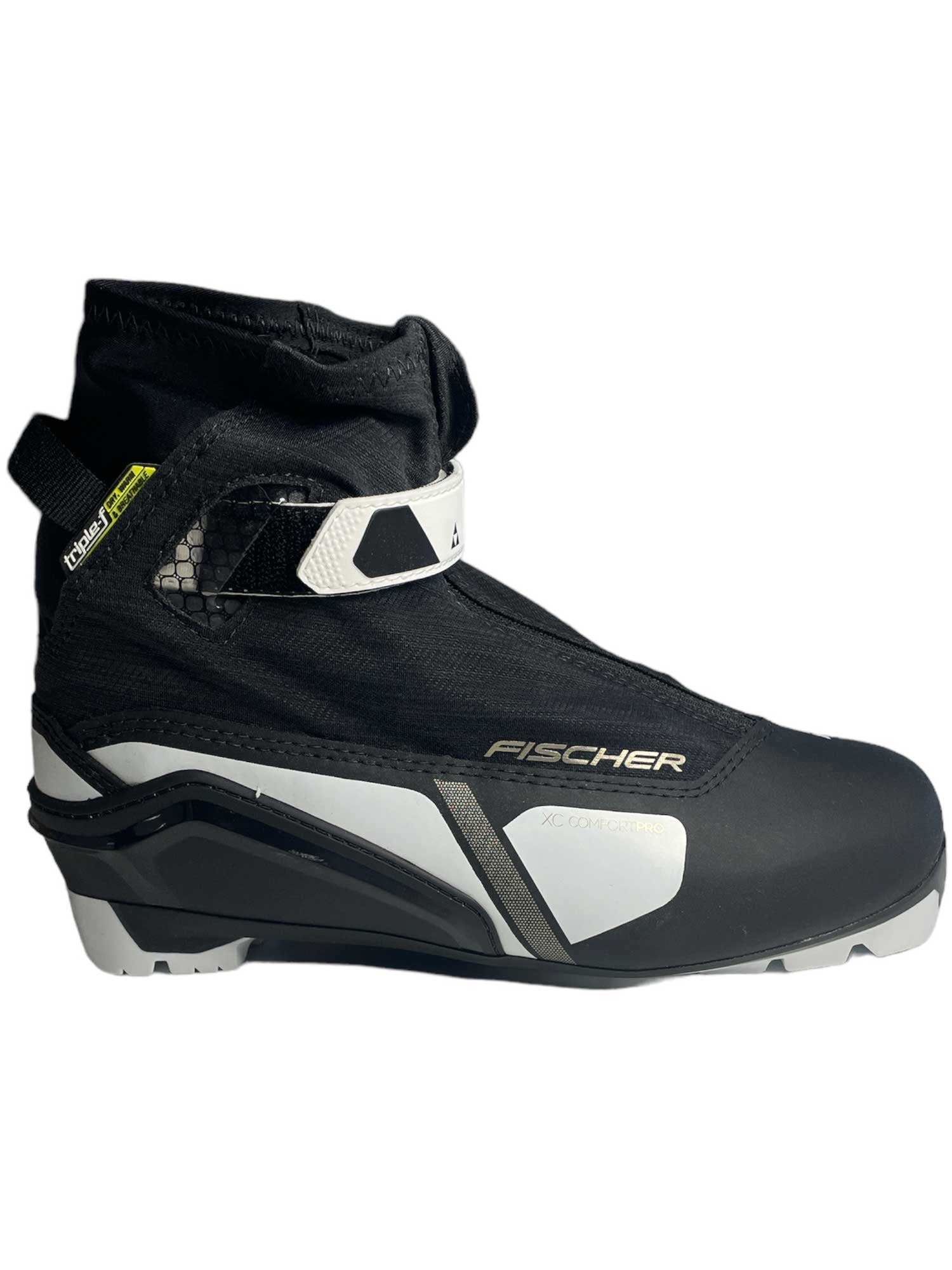 The Fischer Womens XC Comfort Pro Ski Boot features a black and white design, Velcro strap, ankle support, and a modern look—ideal for women’s cross-country skiing.