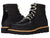 A pair of Kodiak Scotia Black Moccasin Vamp Wedge Shoes features black leather, white stitching, lace-up fronts, tan midsoles, and black outsoles. One shoe faces forward to show laces; the other is angled to reveal the side and back.