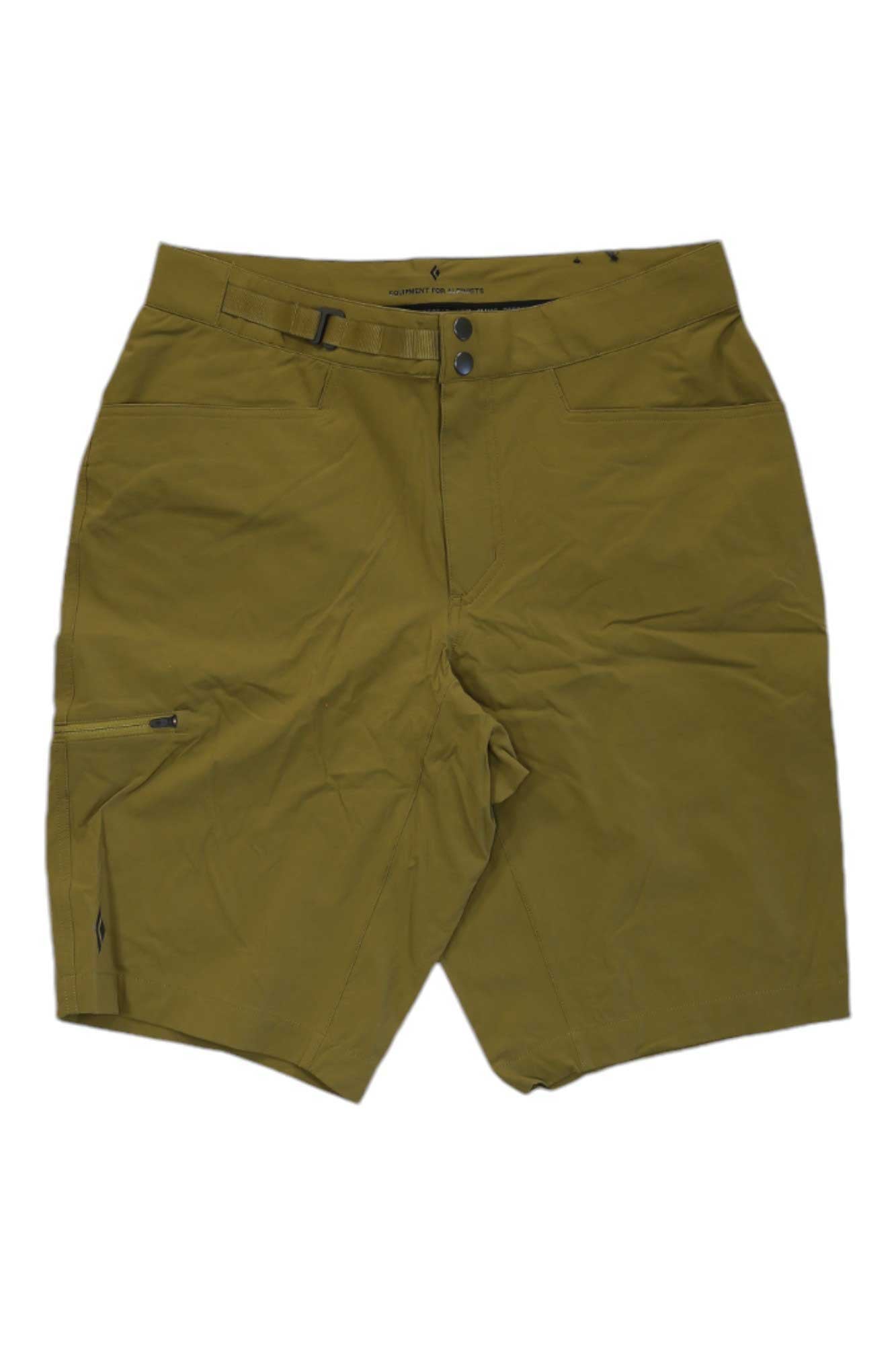 Black Diamond Men's Valley 11.5 Shorts in olive green feature a front zipper, button closure, water-resistant fabric, zippered side pocket, and an adjustable waist belt, shown laid flat on a white background.