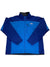 The North Face Apex Bionic Jacket is a blue men’s softshell with a full front zipper, high collar, zip chest pocket, darker blue sleeves and shoulders, and the logo on the left chest.