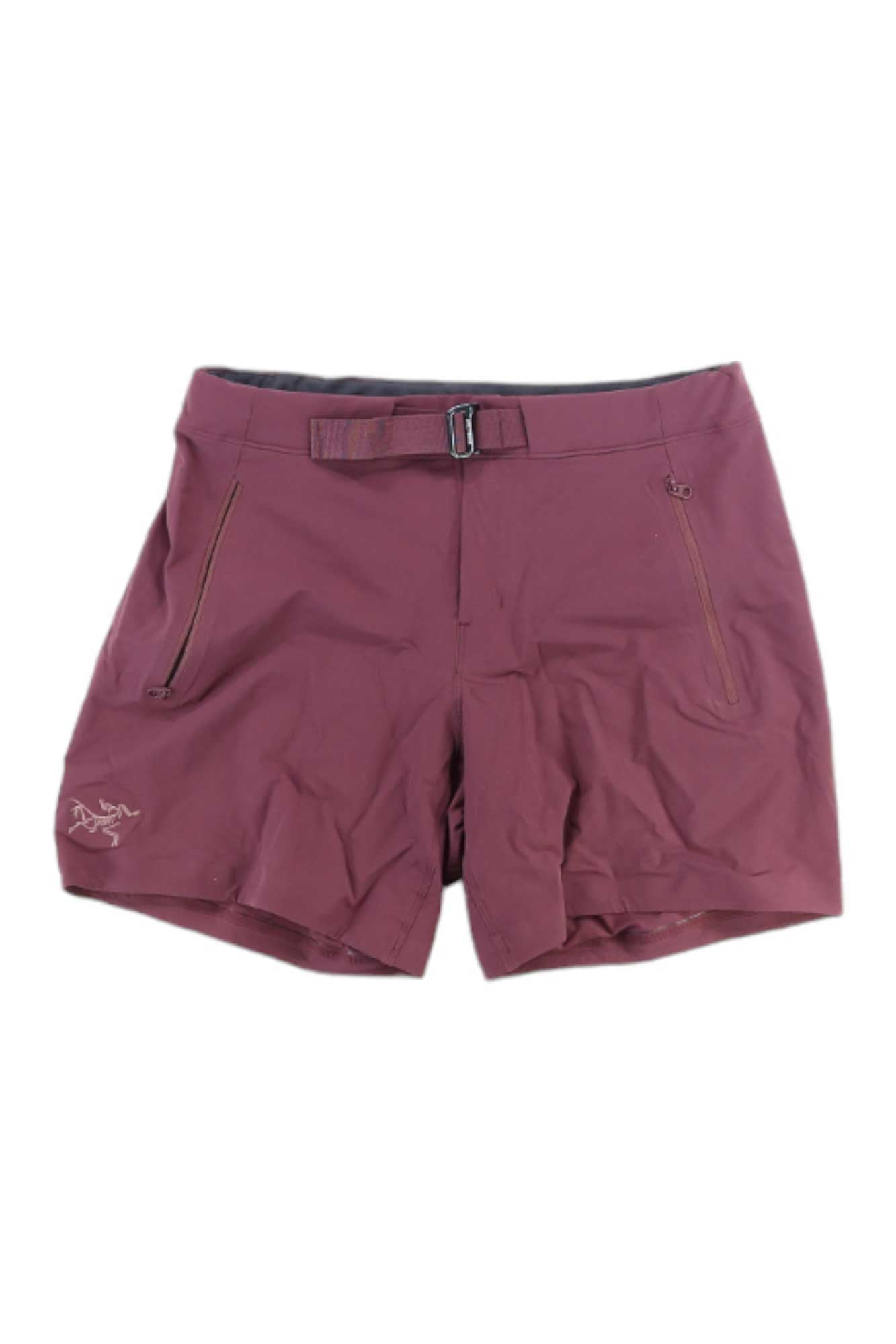 Arcteryx Womens Gamma LT 6 Inch Short in burgundy features zippered side pockets, a front zipper, belt buckle, and Arcteryx logo on the lower left leg. Store exclusive style; available for shipping to US addresses only.