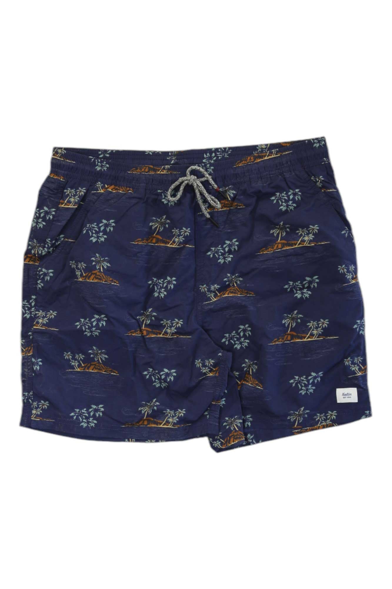 The Katin Men's Hani Volley Short features a navy tropical island and palm tree print on quick-drying nylon, with an elastic waistband, white drawstring, side pockets, and a white logo patch on the bottom left leg.