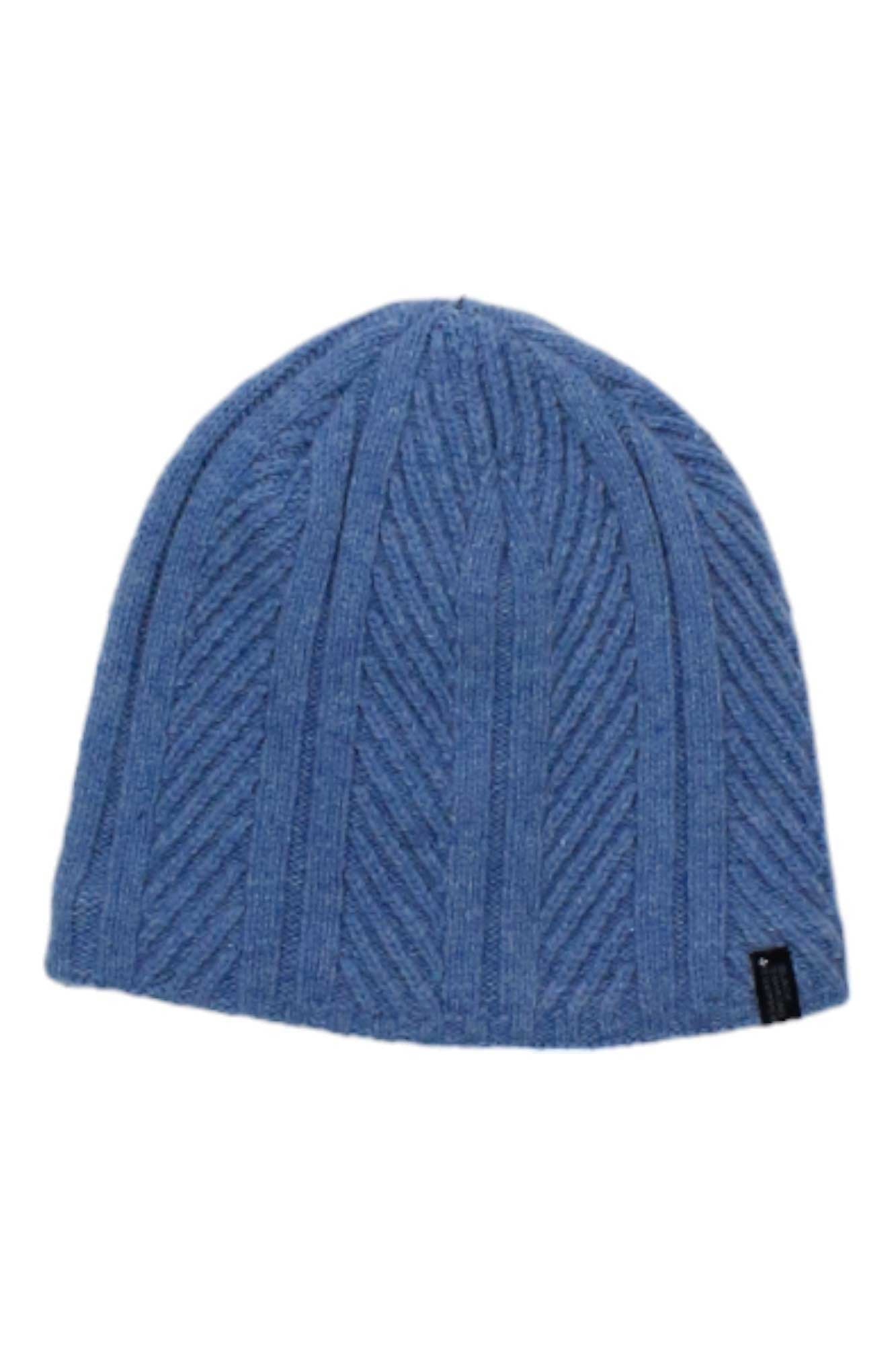 The Black Diamond Womens Tracks Beanie features a blue knit with a ribbed diagonal pattern and a small black tag, offering warmth and style for chilly outdoor days.