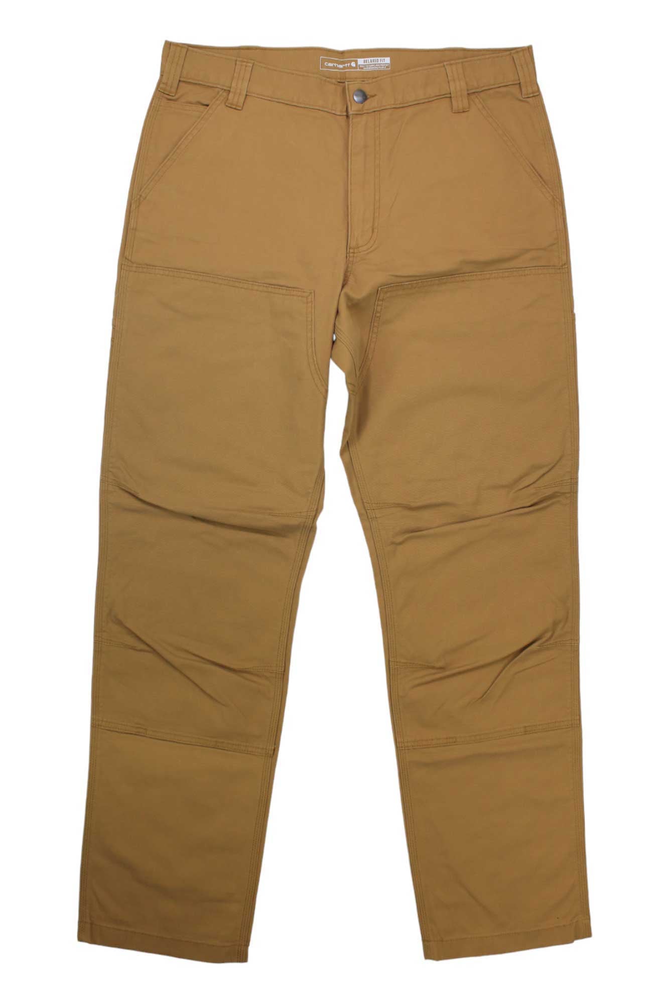 A pair of Carhartt Men's Rugged Flex Rigby Double-Front Pants in tan with reinforced knees, straight-leg design, front and back pockets, and belt loops is laid flat on a white background.
