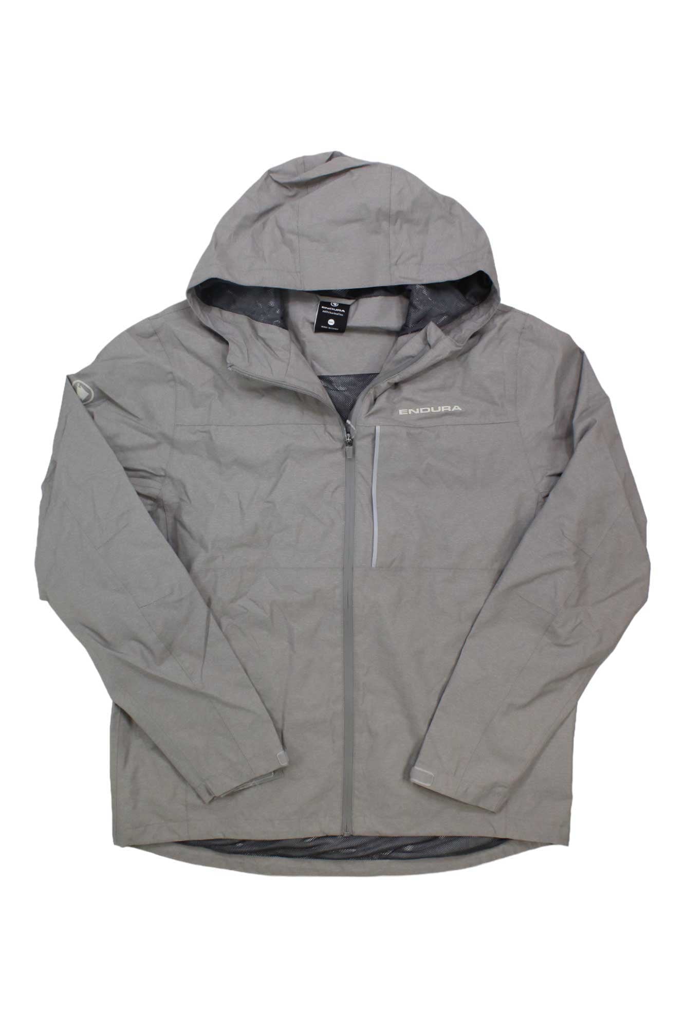 The Endura Mens Hummvee Waterproof Hooded Jacket is a light gray, breathable men’s rainwear jacket featuring a hood, front zipper, zippered chest pocket, and ENDURA logo on the left chest. It is shown laid flat with sleeves slightly bent.