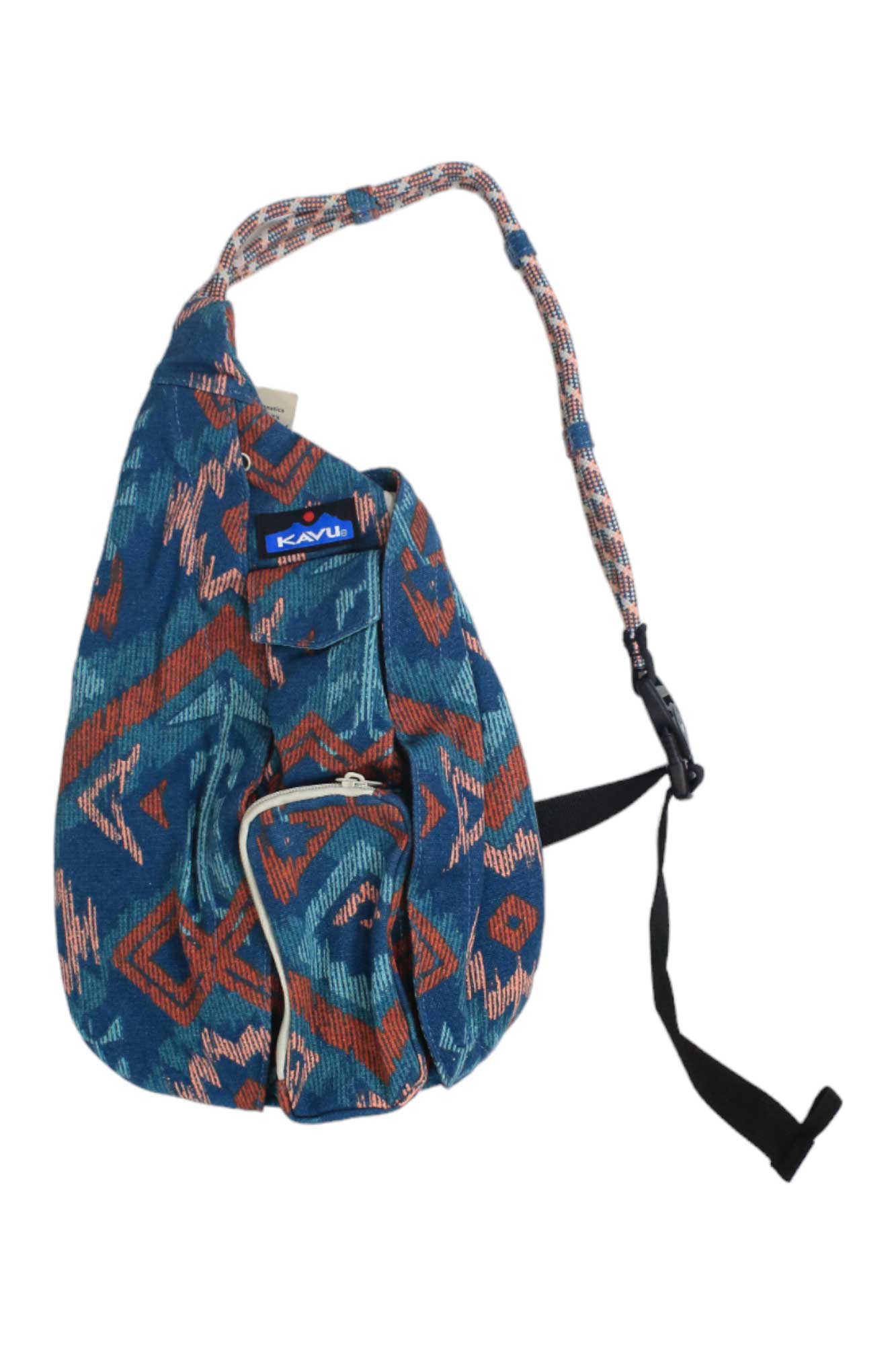 The KAVU Women's Mini Organic Rope Bag is a colorful sling pack made from organic cotton canvas with a blue, red, and white geometric pattern, rope-style strap, and front zip pocket.