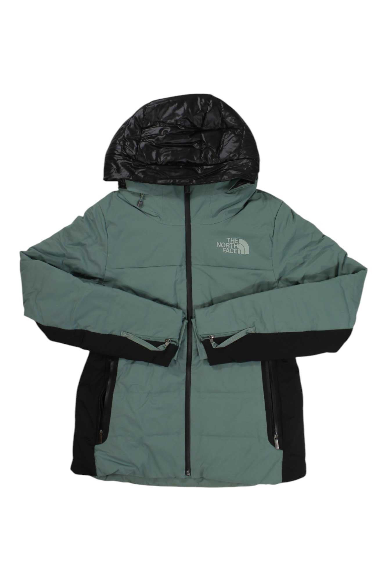 A green and black The North Face Womens Amry Down Jacket with hood, front zipper, and zippered pockets is laid flat on a white background.