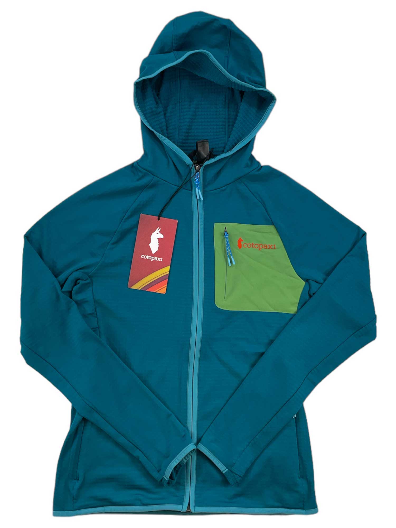 A Cotopaxi Womens Otero Fleece Full-Zip Hooded Jacket in teal, featuring a green chest pocket, blue zipper, and tags on the front, is laid flat on a white background.