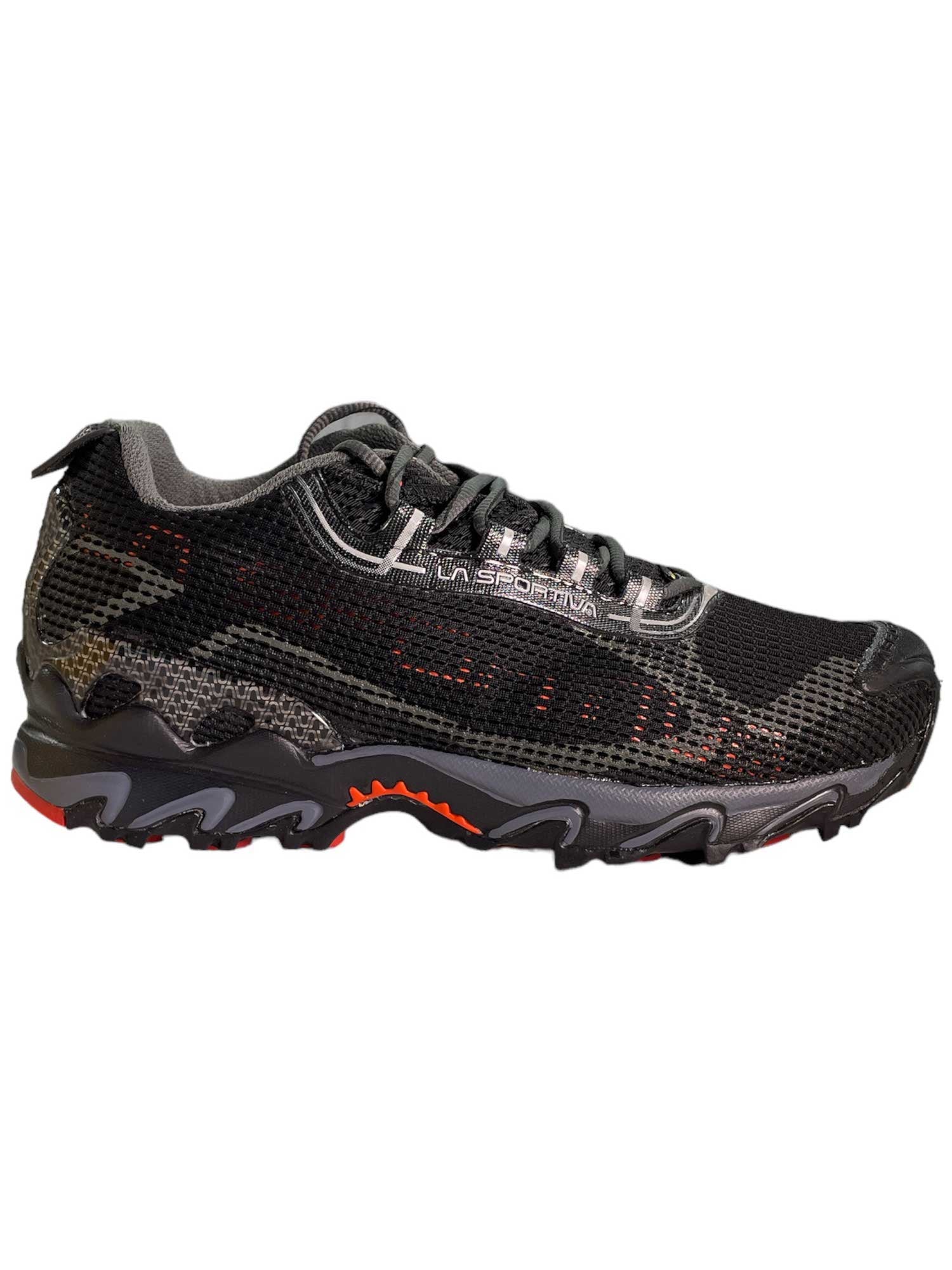 Men’s trail shoe with lace-up knit upper, black and orange accents, rugged rubber outsole