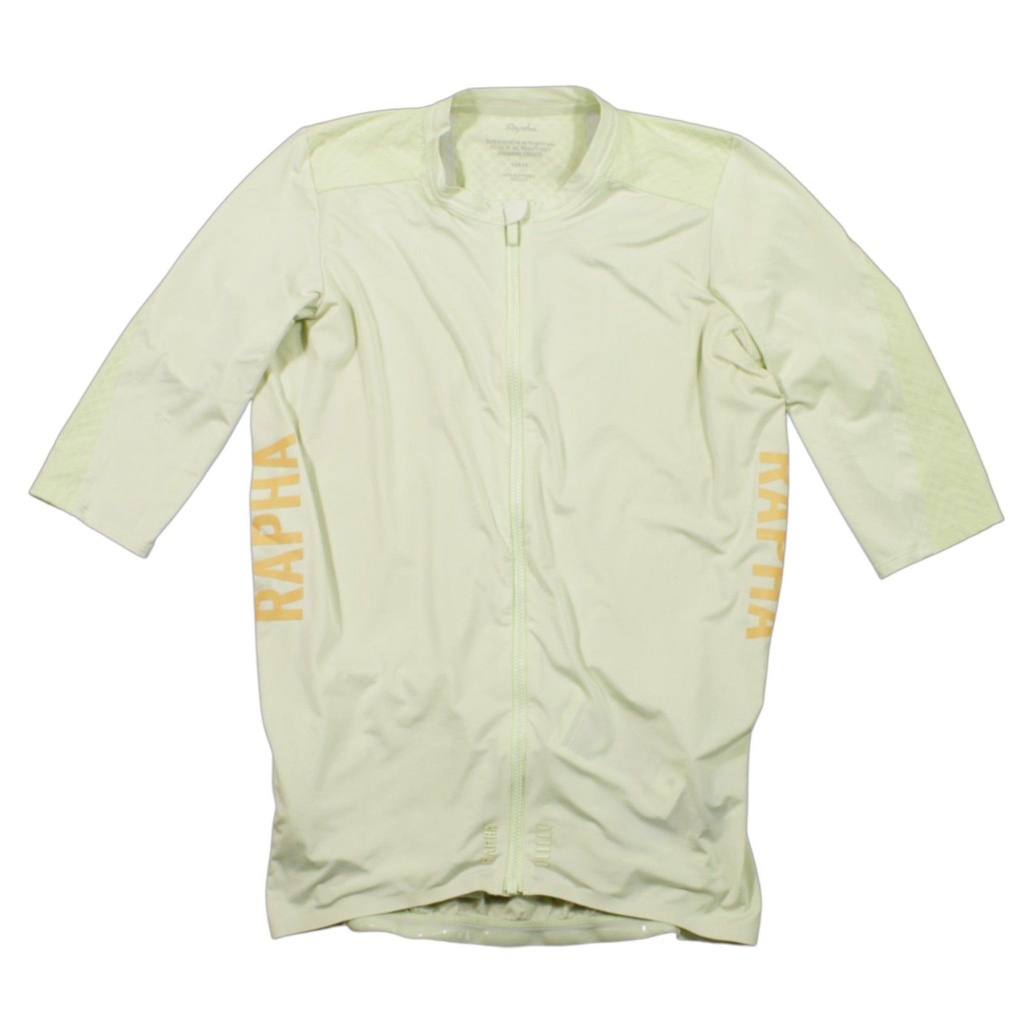 The Rapha Pro Team Aero Jersey is a light yellow, long-sleeve cycling skinsuit with a front zipper and RAPHA in large light orange letters on both sides. It’s close-fitting for aerodynamics, with no visible front logos or patterns.