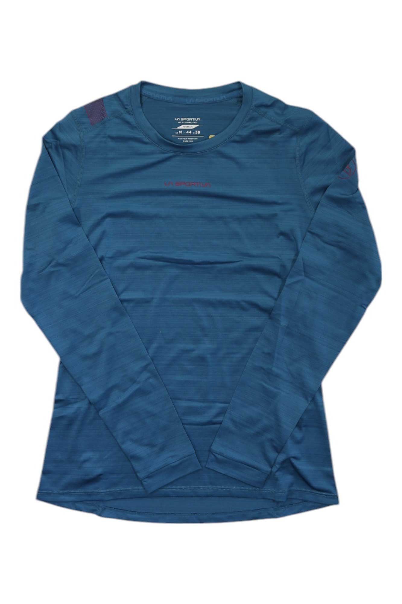 The La Sportiva Women's Tour LS Top is a solid teal-blue, long-sleeve crew neck shirt with minimal branding. Shown laid flat on a white background, this breathable, quick-drying top has no visible accessories.