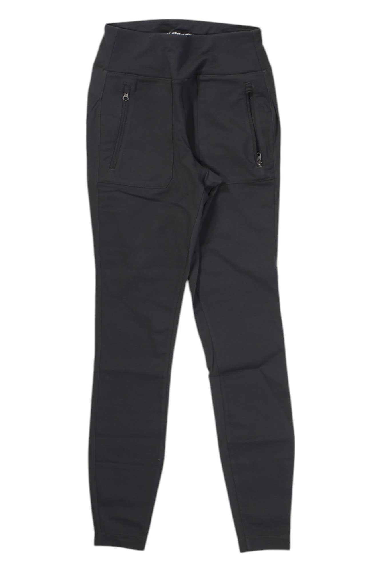 The North Face Women's Paramount Active Hybrid High-Rise Tight, shown flat on a white background, features black color, two front zippered pockets, slim fit, smooth texture, and hybrid fabric ideal for everyday wear.