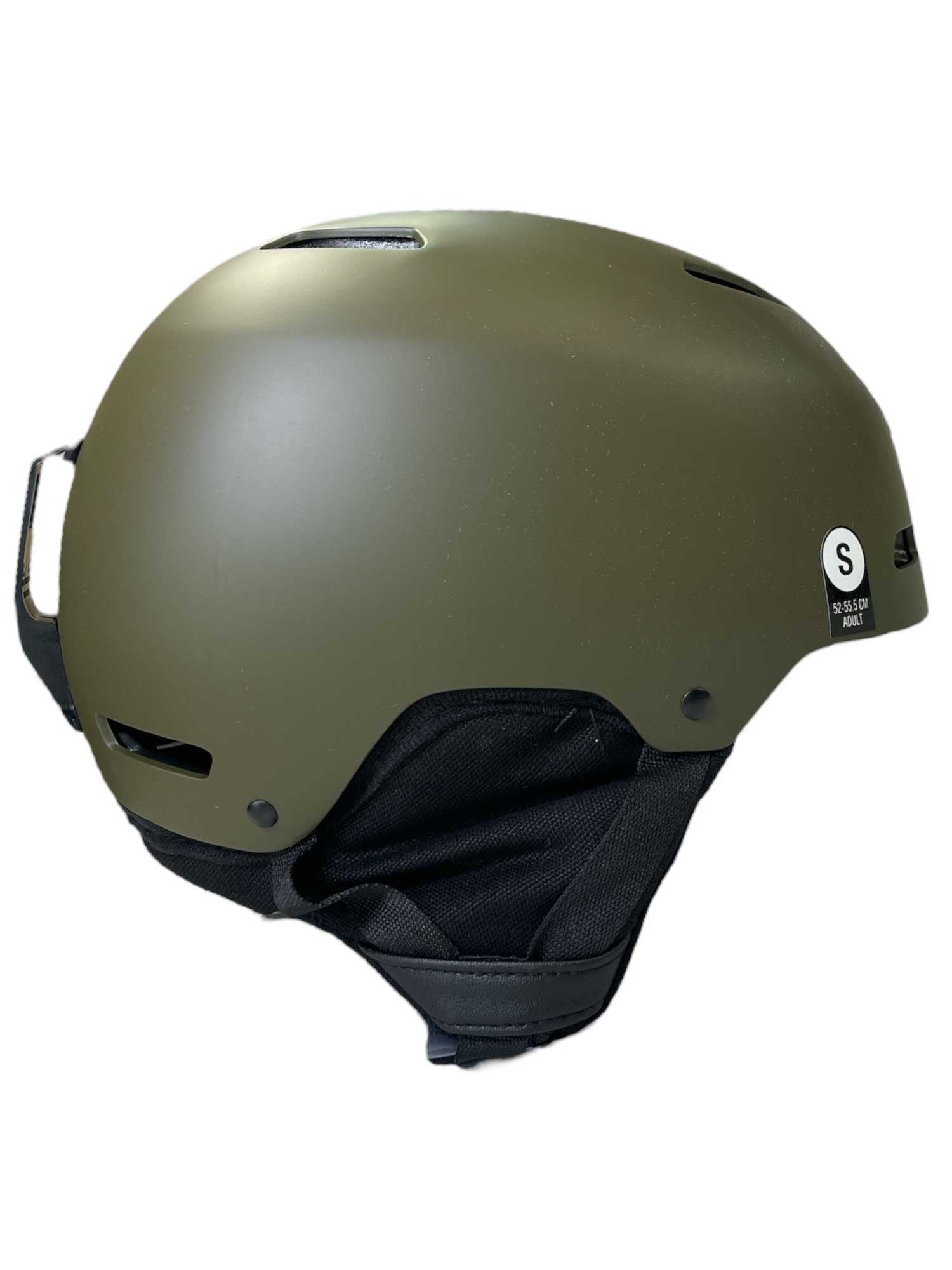 The Giro 16 M Ledge Mips is a matte olive green snow helmet with black ear and chin padding, side vents, and a small white S sticker on the back—ideal for snowboarding or skiing.