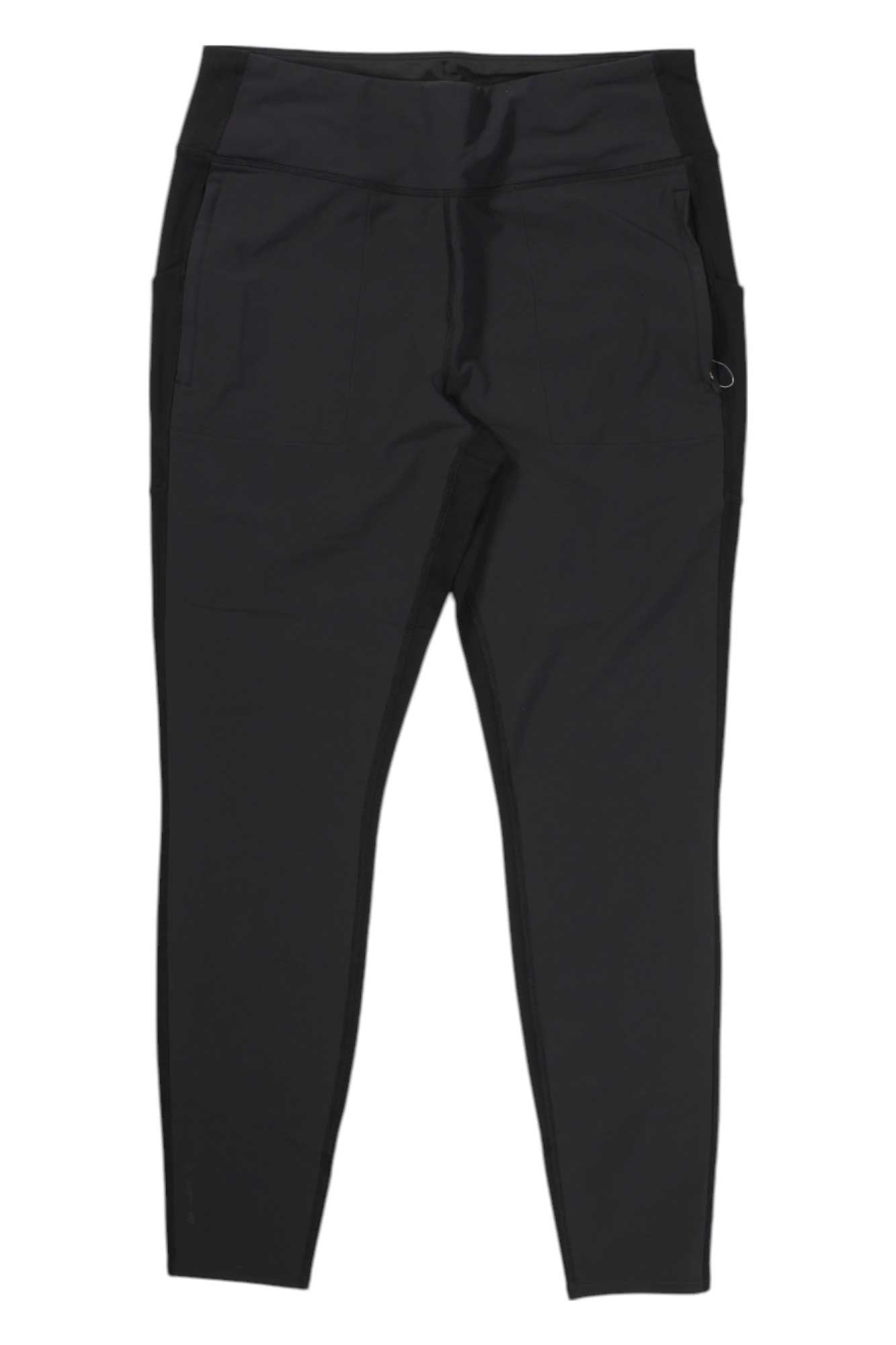 The North Face Womens Bridgeway Hybrid Tight features black athletic leggings with a high waistband, side pockets, and a fitted, tapered leg. Stretchy, smooth fabric makes them perfect for sports or casual wear.