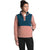 A woman wears the North Face Womens Mountain Sweatshirt Pullover 3.0 with a teal top and dusty pink bottom, paired with black leggings. She stands with one hand in her pocket, hair tied up, looking to the side.