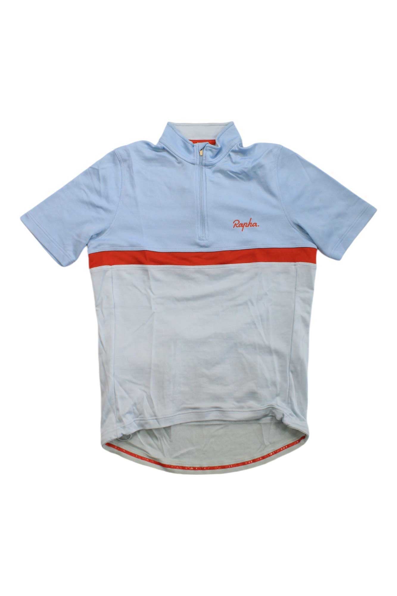 The Rapha Mens Clubhouse Jersey is a light blue short-sleeve cycling top with a red chest stripe, half-zip neckline, and the Rapha logo embroidered on the left chest.