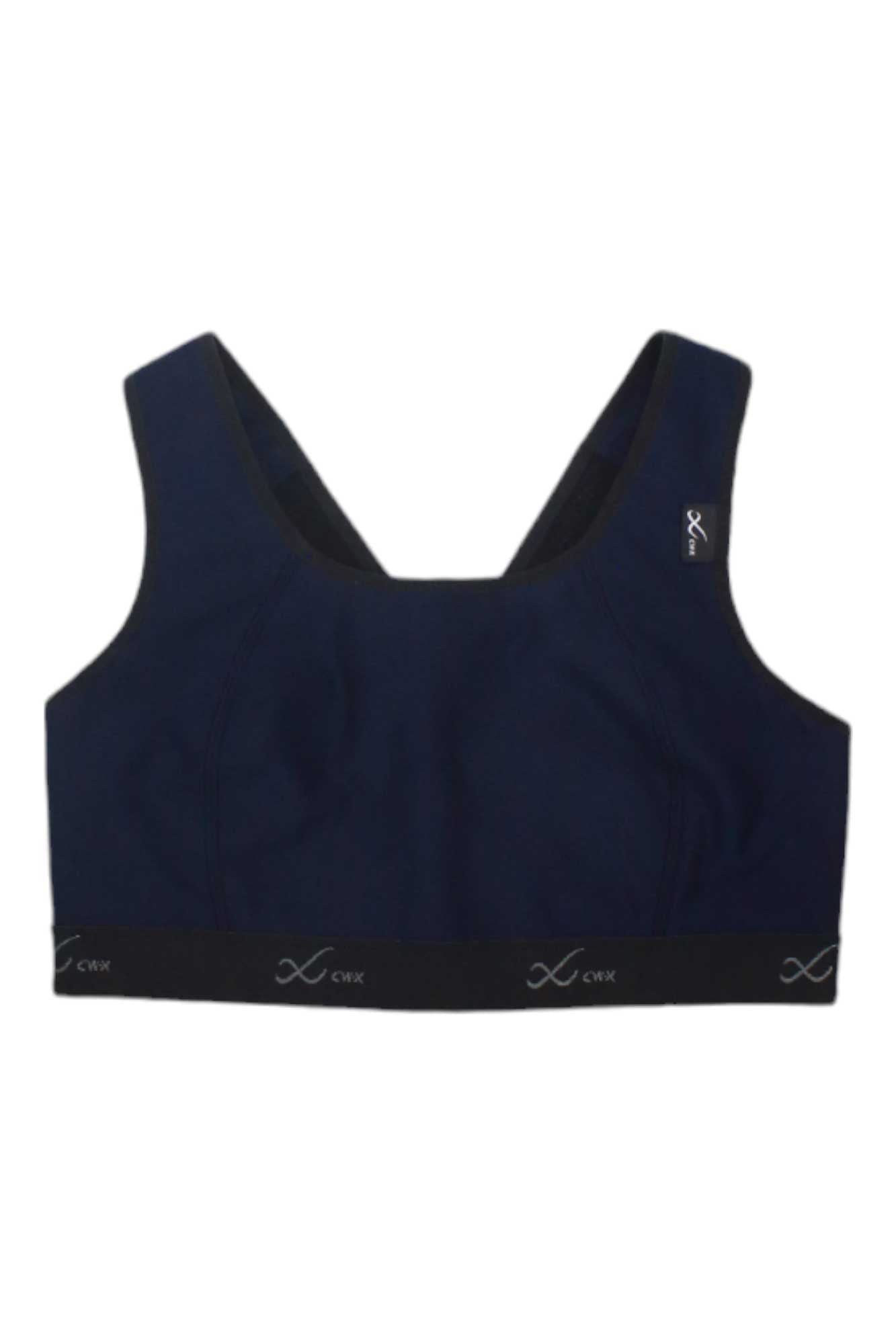 The CW-X Womens Xtra Support High Impact Sports Bra features wide straps, a black elastic band, small white logos, and moisture-wicking navy blue fabric—perfect for running and intense workouts.