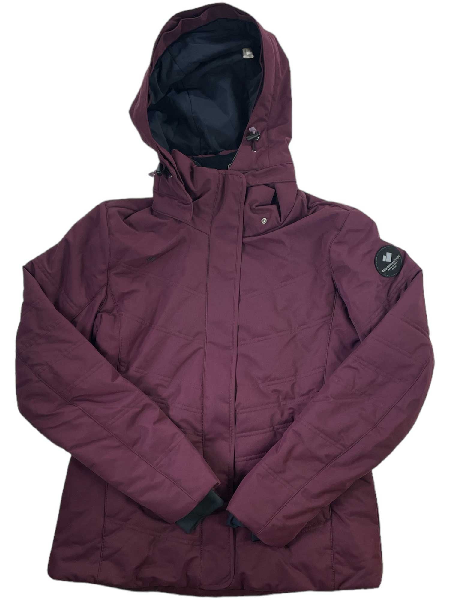 A maroon Tuscany II Jacket with a hood, long sleeves, a front zipper under a flap, and a black patch on the left upper sleeve is laid flat on a white background.