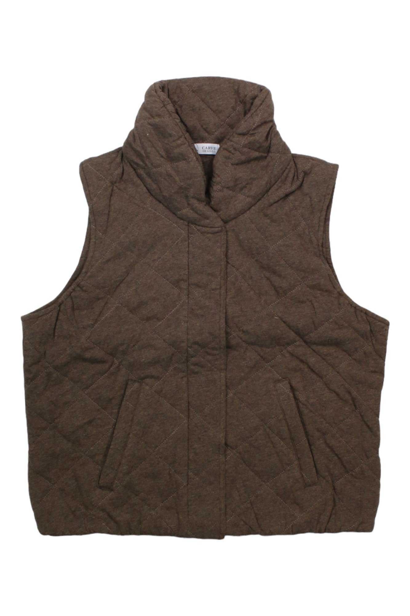 The Carve Designs Womens Betty Vest is a brown, sleeveless vest for women made from organic cotton, featuring a high collar and two slanted front pockets, shown laid flat on a white background.