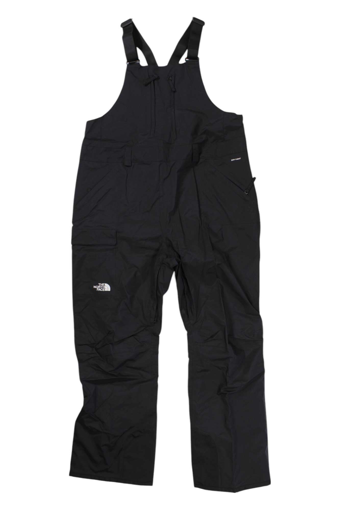 The North Face Womens Plus Freedom Bib Pant for Black women features adjustable shoulder straps, multiple zippered pockets, and a logo on the left thigh. This durable, waterproof winter bib is ideal for outdoor and snow activities.