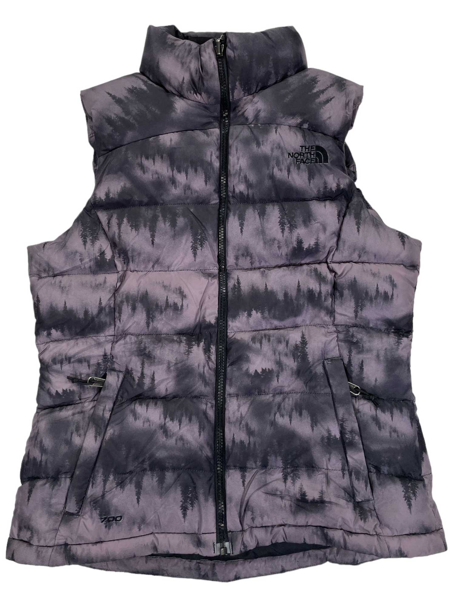 The Womens Nuptse 2 Down Vest by The North Face is a sleeveless, zip-up vest with a high collar, black and grey forest silhouette pattern, 700-fill-power goose down, and two front zippered pockets.