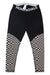 The Mons Royale Women's Cascade Legging is a black merino wool baselayer for women, featuring MONS ROYALE on the waistband and a bold black-and-white checkerboard pattern on the lower legs—perfect for skiing.