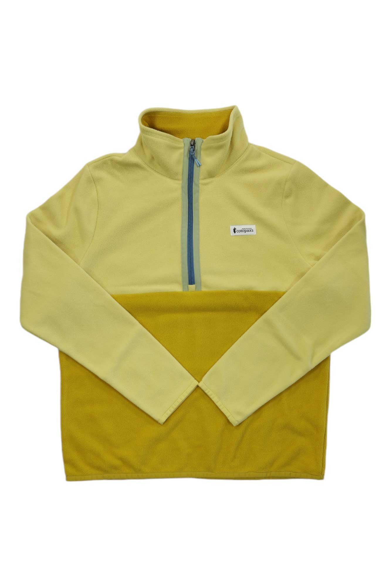 The Cotopaxi Womens Amado 1/4 Zip Fleece Pullover is a cozy pullover made from recycled fleece, featuring pale yellow and mustard yellow panels with a small rectangular chest logo.