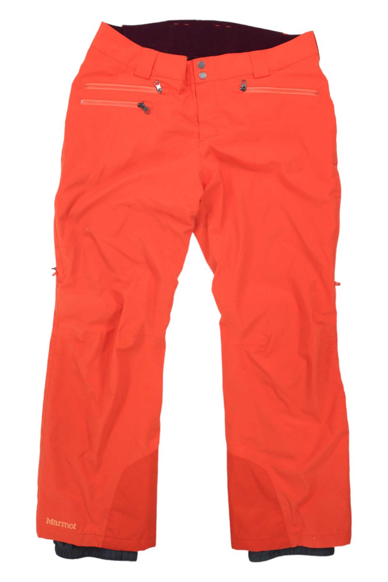 Marmot Womens Slopestar Pant in bright orange, featuring PrimaLoft insulation, waterproof fabric, zippered pockets, and button closure, displayed flat on a white background.
