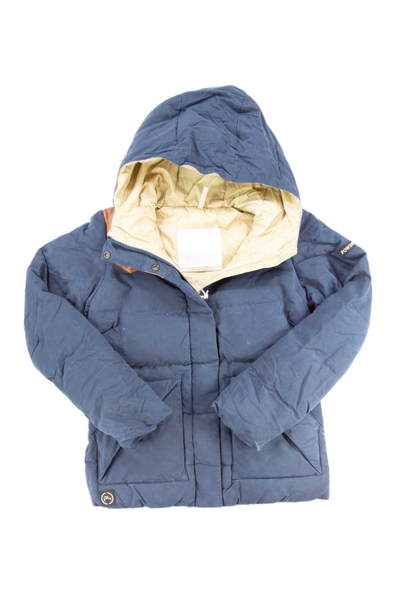 The Powderhorn Womens Jackson Shot 7 Jacket in blue features a beige lining, front pockets, and a small circular logo near the hem. It is displayed on a white background.
