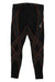 The CW-X Men's Endurance Generator Compression Tight features black fabric with orange crisscross lines and a small white logo on the upper right thigh. These tights provide joint and muscle support and are shown flat on a white background.