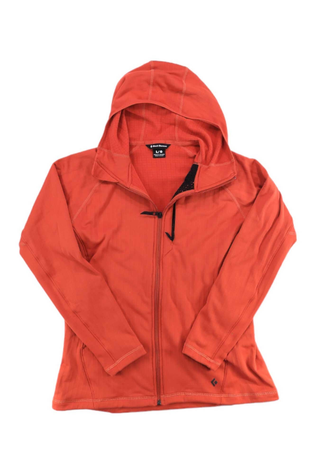 The Black Diamond Womens Factor Fleece Hoody, shown in bright orange, features long sleeves, a drawstring neck, visible stitching, and is made from stretch polyester wool fabric. The technical fleece is displayed laid flat on a white background.